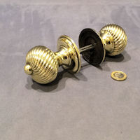 Pair of Swirled Ribbed Brass Door Handles