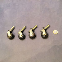 Set of 4 Brass and Cow Horn Castors